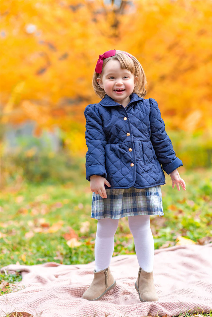 child with coat in the fall