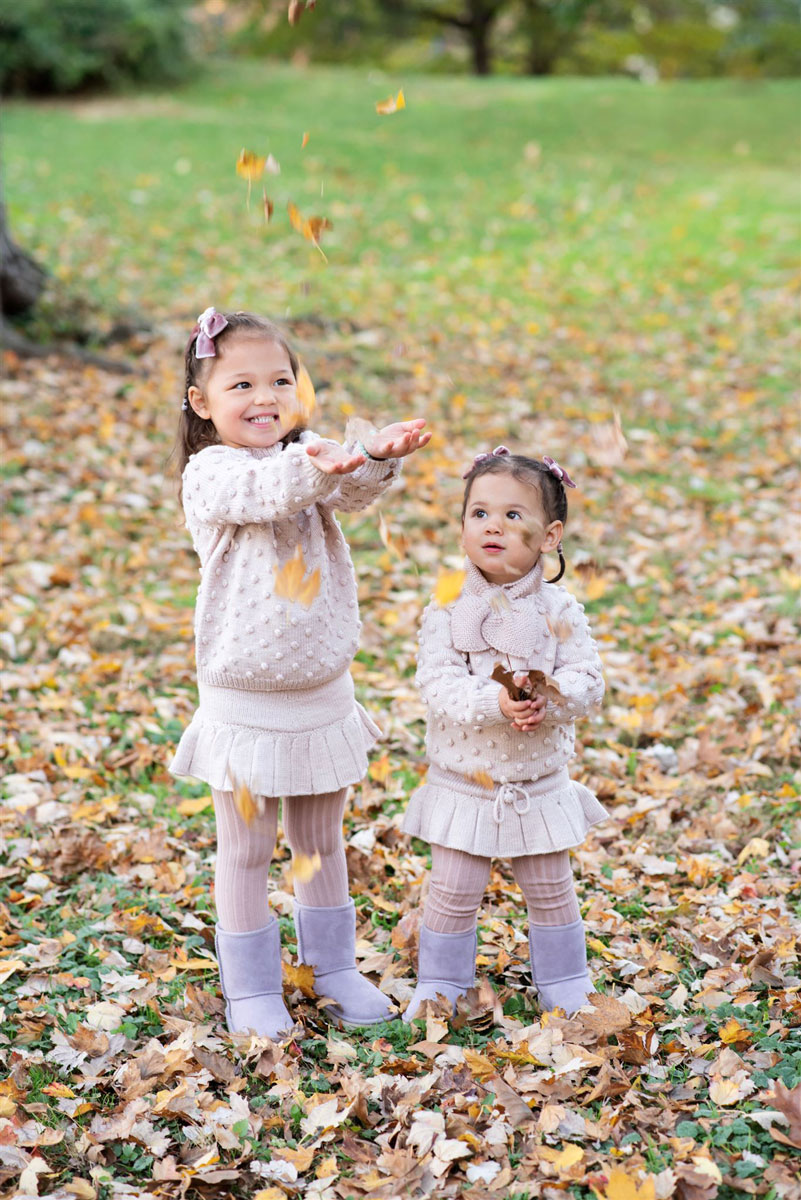 kids playing with leaves