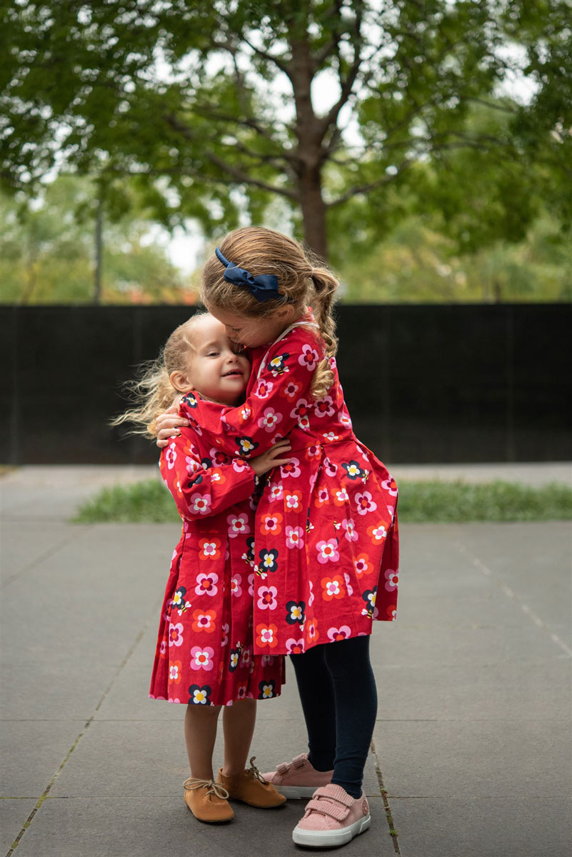 young sisters hugging