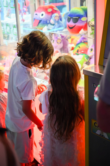 enjoying arcade games at a birthday party in the hamptons